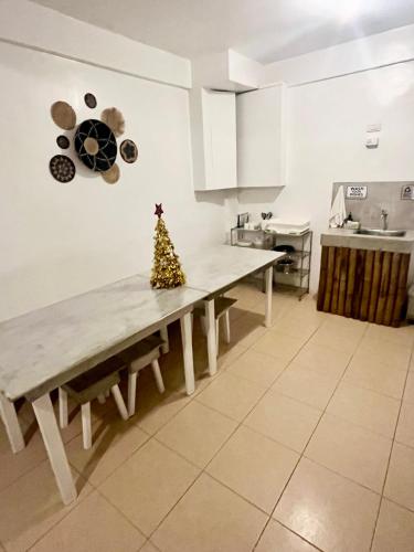 a kitchen with a table with a christmas tree on it at Caleo Boracay Island Station 3 in Boracay