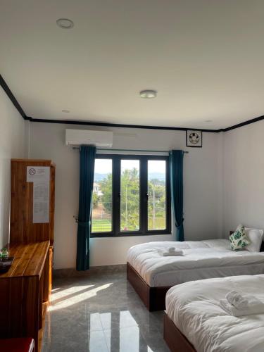 Postel nebo postele na pokoji v ubytování MANYTHIP Hotel