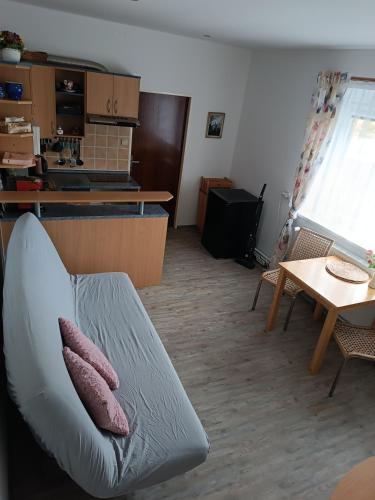 a living room with a couch and a table at Apartmán Teplice nad Metují in Teplice nad Metují