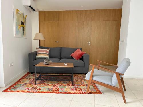 a living room with a couch and a coffee table at Bamba Apartment Aracena-ONLY ADULTS in Aracena