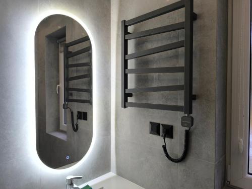 a bathroom with a sink and a mirror at Dobry Dom I in Staszów