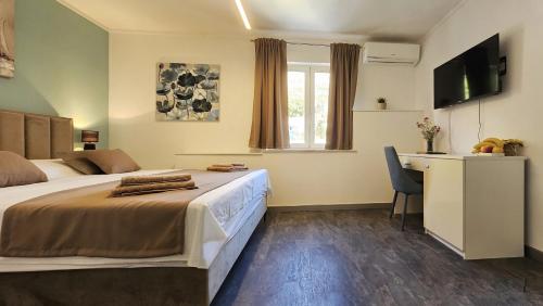 Ένα ή περισσότερα κρεβάτια σε δωμάτιο στο Villa Babilon