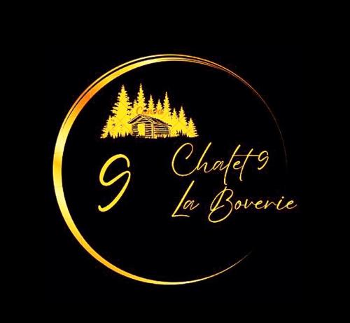 a gold circle sign with a house and trees at Chalet 9 La Boverie in Rendeux