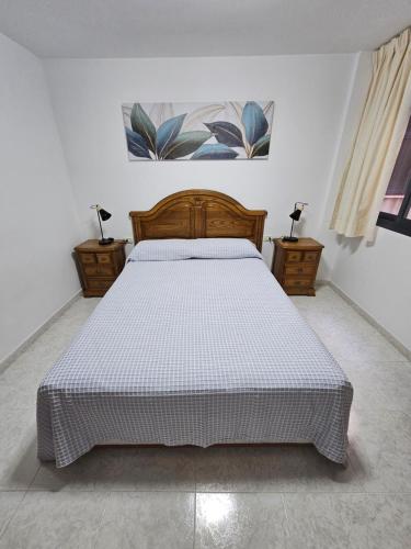 a bedroom with a bed and two night stands at Casa Ulla in Puerto Naos
