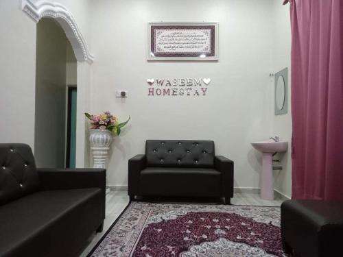Χώρος καθιστικού στο Waseem Homestay Kuala Terengganu