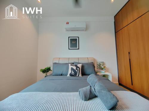 Katil atau katil-katil dalam bilik di Ipoh Meru 3 Bedroom Suites by IWH Suites