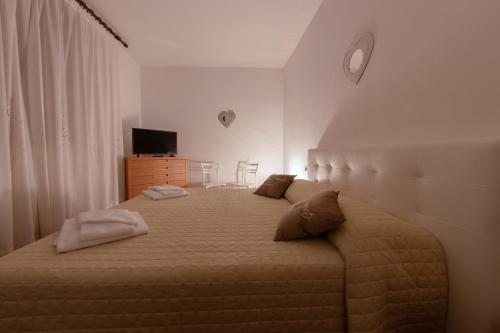 Postel nebo postele na pokoji v ubytování La Casina Di Monica