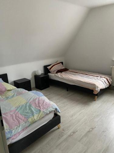 Ένα ή περισσότερα κρεβάτια σε δωμάτιο στο Mig Monteurzimmer