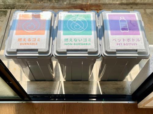 a row of plastic containers sitting on a shelf at Highness Gojo in Dazaifu