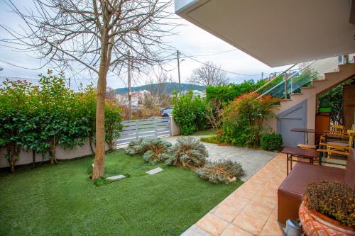 Κήπος έξω από το Chris Cozy Apartment