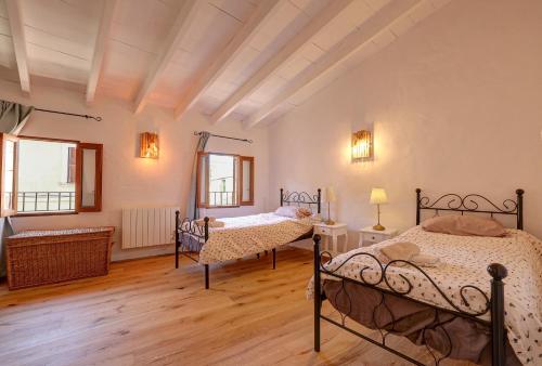 Postel nebo postele na pokoji v ubytování Petra Holiday Home by Rentallorca