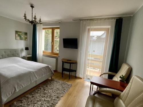 Un pat sau paturi într-o cameră la Villa Wisła