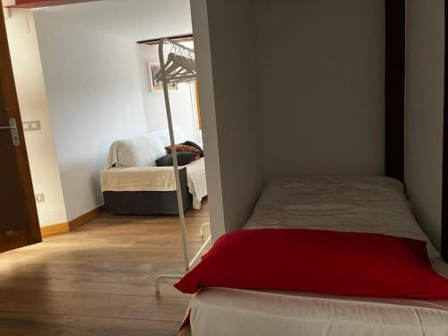 a small room with a bed and a mirror at Atalaya in Mundaka