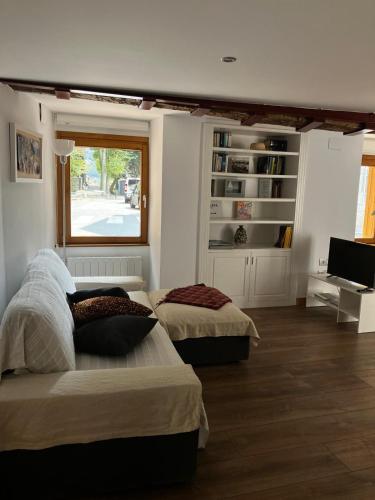 a bedroom with two beds and a window at Atalaya in Mundaka