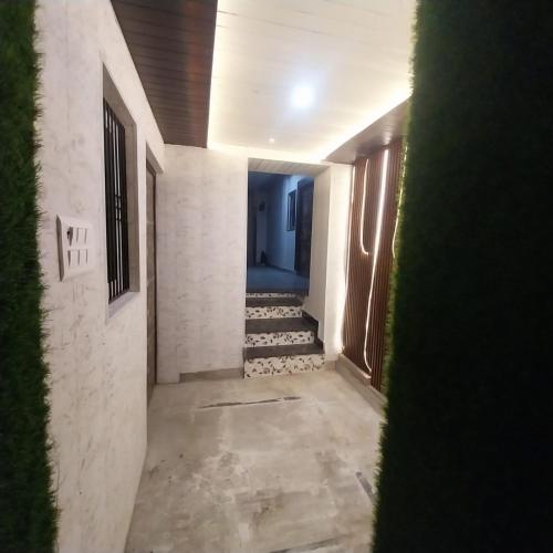 an empty hallway with stairs in a building at ViratHomestay in Varanasi