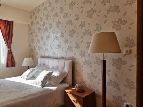 Llit o llits en una habitació de Diva Residence