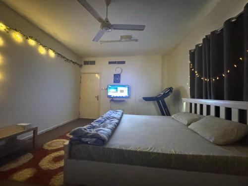 Postel nebo postele na pokoji v ubytování Qidfa apartment