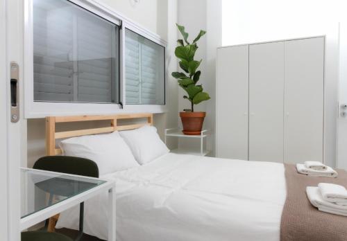 Cama o camas de una habitación en Loveinsky Tel Aviv rooms