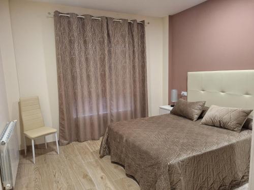 Ένα ή περισσότερα κρεβάτια σε δωμάτιο στο Apartamentos Costa Xuño