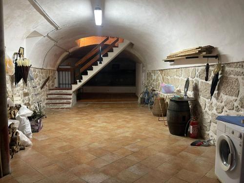 a large room with a staircase in a building at Casa D'Aurora in Pettorano sul Gizio