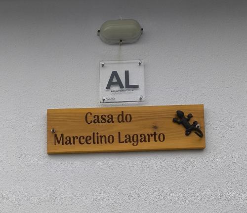 a sign on a wall that reads marceline laboratory at Casa do Marcelino Lagarto in São Roque do Pico