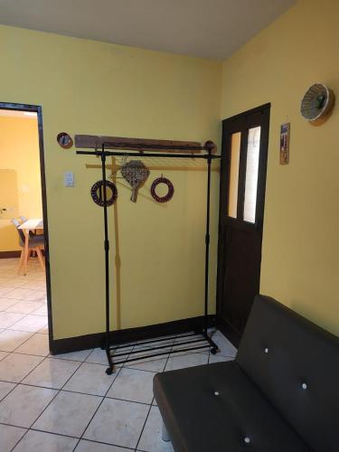 a room with a room with a door and a couch at Casa Francisco's in Antigua Guatemala