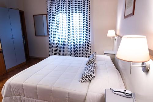 Katil atau katil-katil dalam bilik di Hotel Ai Tufi