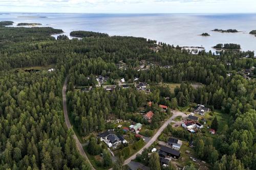 an aerial view of a town with trees and water at Henar Bed & Breakfast in Gävle