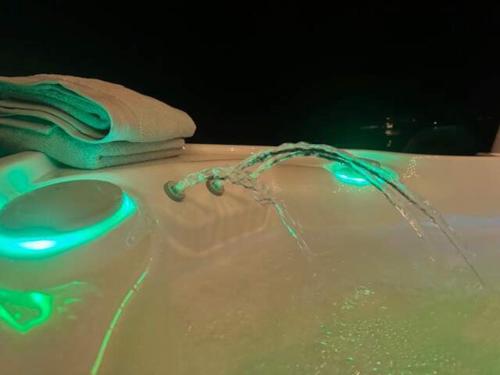 a close up of a cake with a pair of scissors at Zen Retreat met jacuzzi in Grez-Doiceau