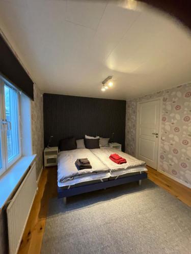 a bedroom with a bed in a room with a window at Henar Bed & Breakfast in Gävle