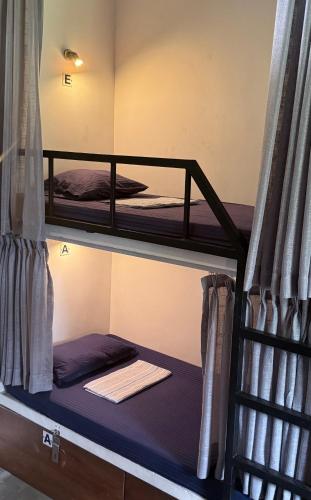 a couple of bunk beds in a room at The Hostel in Mirissa