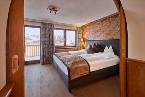 Katil atau katil-katil dalam bilik di Hotel & Chalet Montana