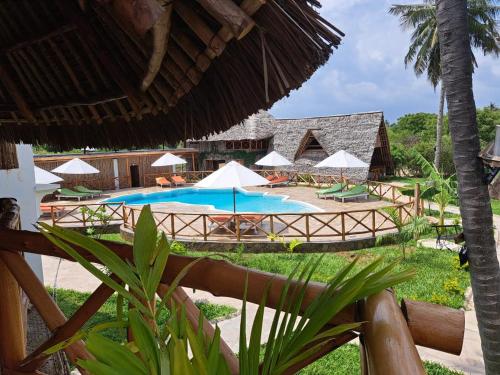 a view of a pool at a resort at Kirepwe Ecco Camp Watamu in Watamu