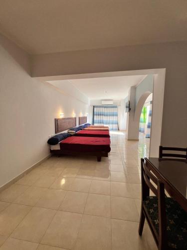 a large bedroom with a bed in the middle of a room at Sea Life Apartments-hotel in Hurghada