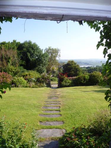 a stepping stone path through a field of grass at Roskear Farm in Wadebridge