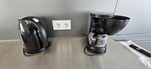 a coffee maker sitting on top of a counter at Villa met zeezicht & infinitypool Jan Thiel Curacao in Jan Thiel