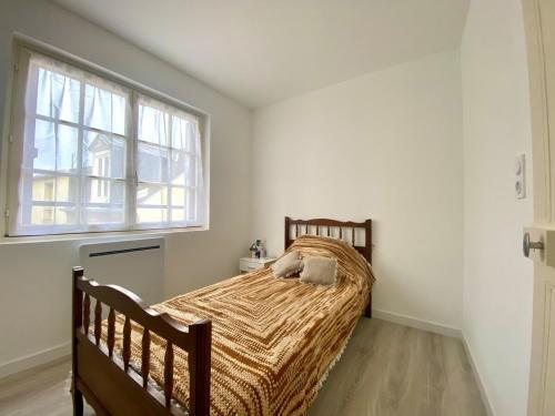 Giường trong phòng chung tại Coucher de soleil - Maison familiale tout confort au cœur d'Ault - Mer