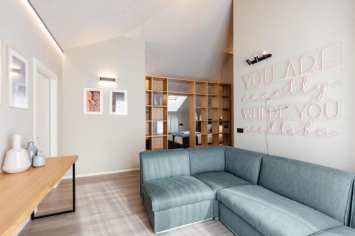 a living room with a couch and a table at Terra Hotel Boutique in Tirano