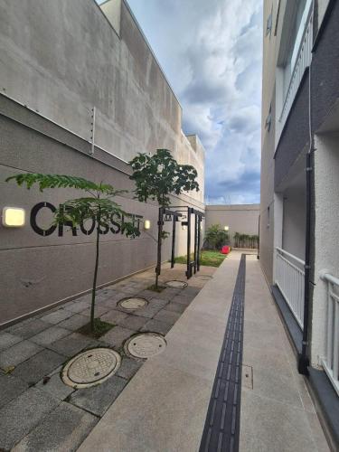 a building with a sign on the side of it at Estúdio Itaquera, Neo Química Arena, GRU Aeroporto Guarulhos in Sao Paulo
