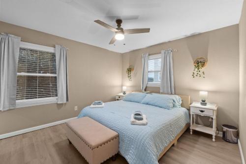 a bedroom with a bed and a ceiling fan at Outer Banks Haven New Kitchen and New Outdoor Areas in Kitty Hawk Beach