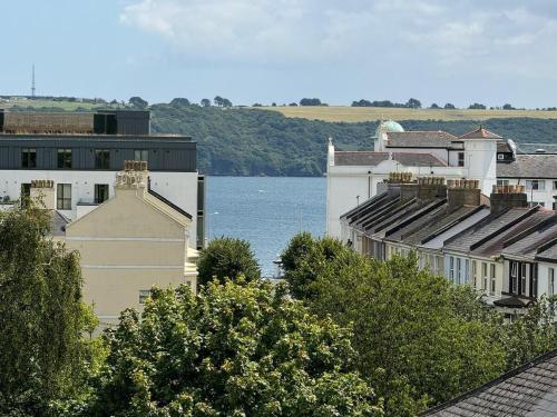 a group of buildings next to a body of water at Saltram By Pureserviced in Plymouth