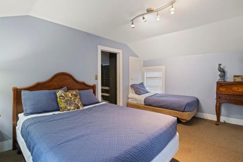 a bedroom with two beds and a dresser at NEW Cayuga, Hot Tub, Dog Friendly, Wine Trail in Cayuga