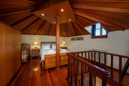a bedroom with a bed and a wooden ceiling at Suite del Capitano in Rhodes Town