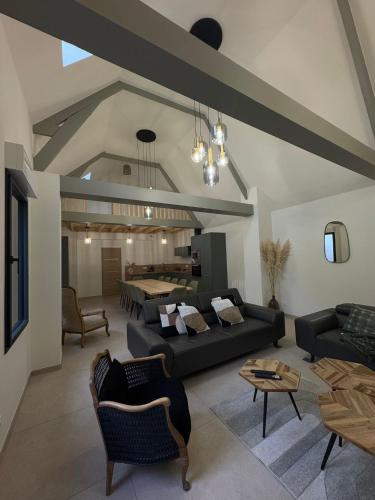 a large living room with couches and a table at Hortense in Étaples