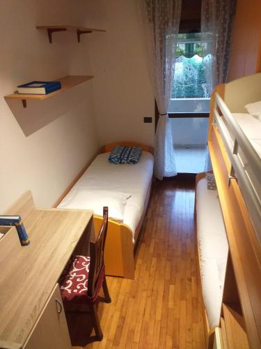 Postel nebo postele na pokoji v ubytování Casa Gabbiano near Venice by train