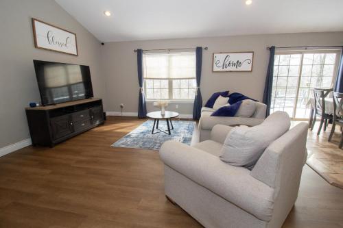 a living room with two couches and a television at Gateway Retreat 27 miles to Fort Leonard Wood in Saint Robert