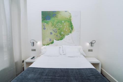 Postel nebo postele na pokoji v ubytování Hostal Acuarela
