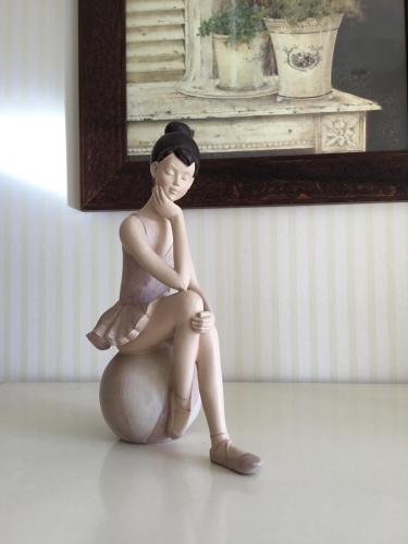 a figurine of a woman sitting on a ball at Côté campagne in Pierrefaites