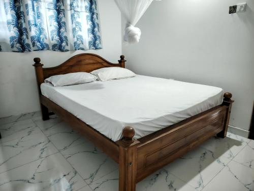 Ένα ή περισσότερα κρεβάτια σε δωμάτιο στο Cozy & Convenient Apartment