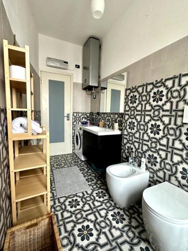 a bathroom with a sink and a toilet in it at Casa Jole in Ceriale
